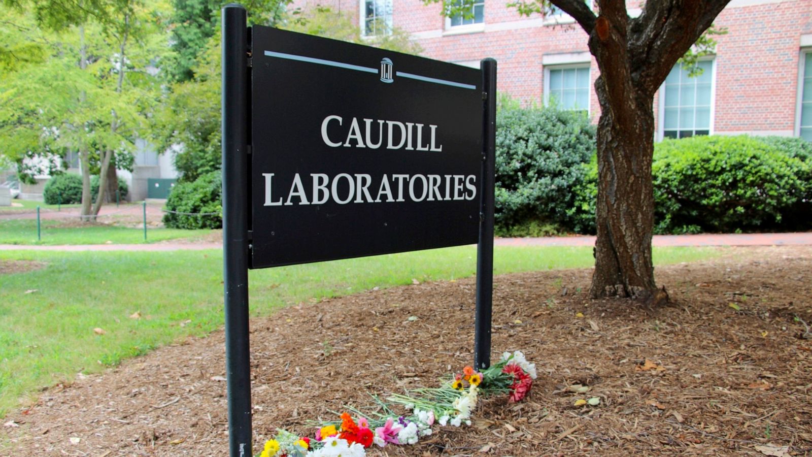 PHOTO: Flowers are seen piled up in front of Caudill Laboratories, Aug. 29, 2023, on the UNC-Chapel Hill campus, where a graduate student fatally shot his faculty advisor this week in Chapel Hill, N.C.