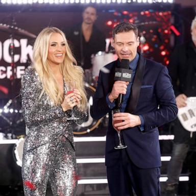 PHOTO: Carrie Underwood and Ryan Seacrest speak during Times Square New Year's Eve 2025 Celebration on December 31, 2024 in New York City.