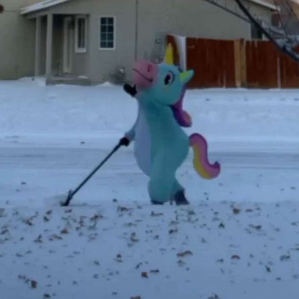 VIDEO: Mom dresses as a unicorn to shovel snow