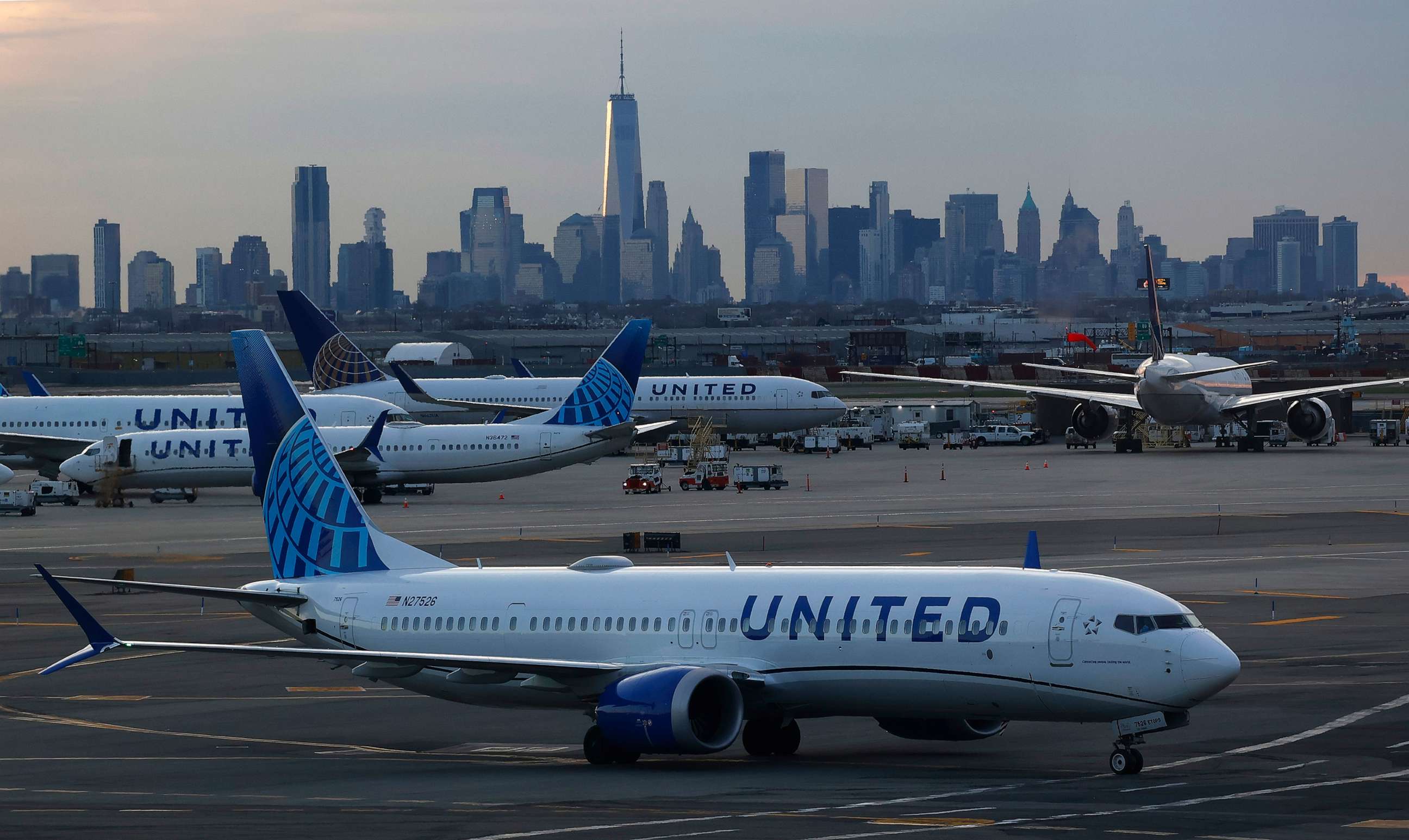 PHOTO: A United Airlines airplane makes its way to a gate in front of the skyline of lower Manhattan at Newark Liberty Airport, April 8, 2023, in Newark, N.J.