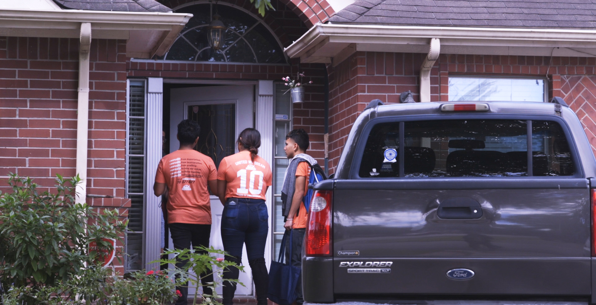PHOTO: United We Dream volunteers canvass Houston, knocking on doors asking residents to vote.