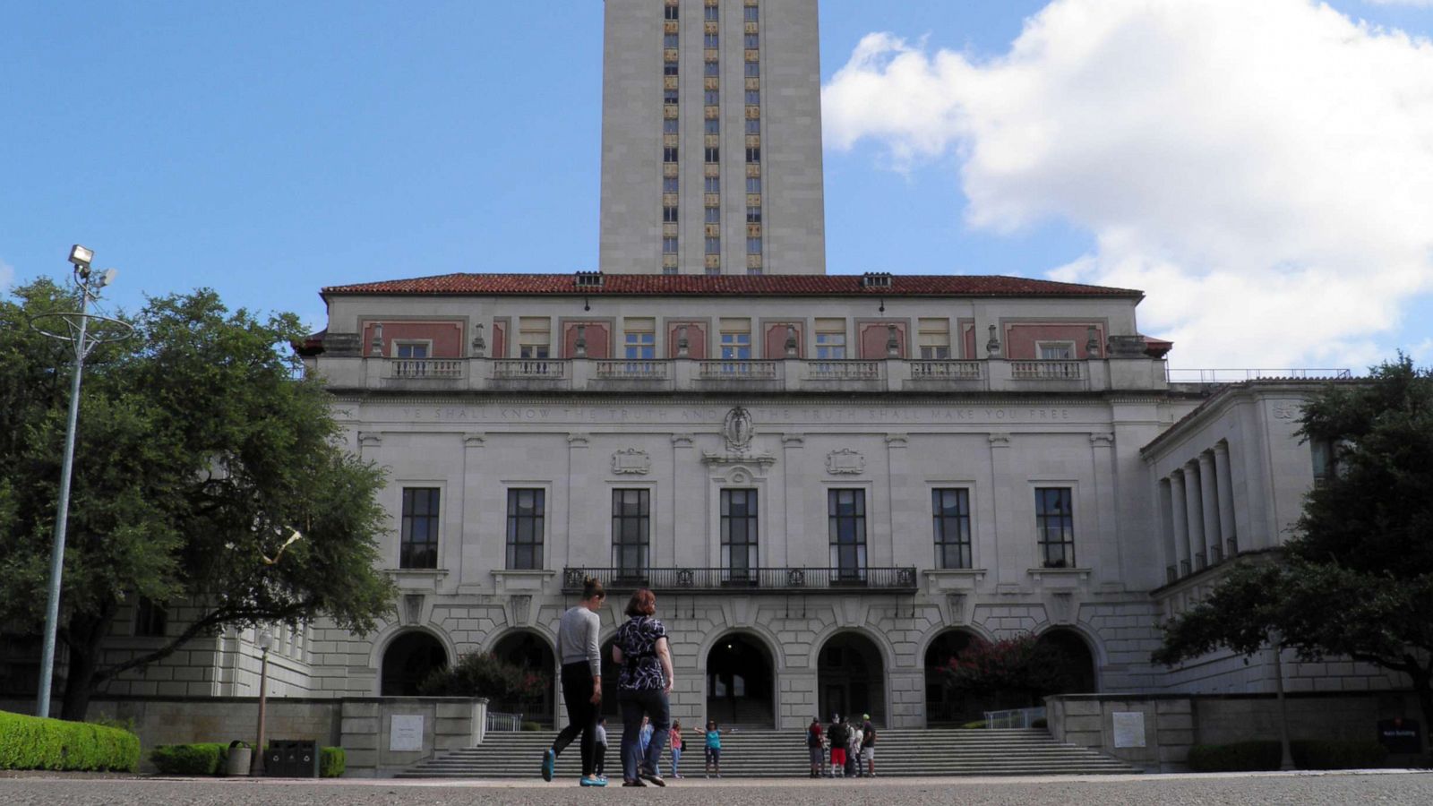 PHOTO: In this file photo, people walk at the University of Texas campus in Austin, Texas, on June 23, 2016.