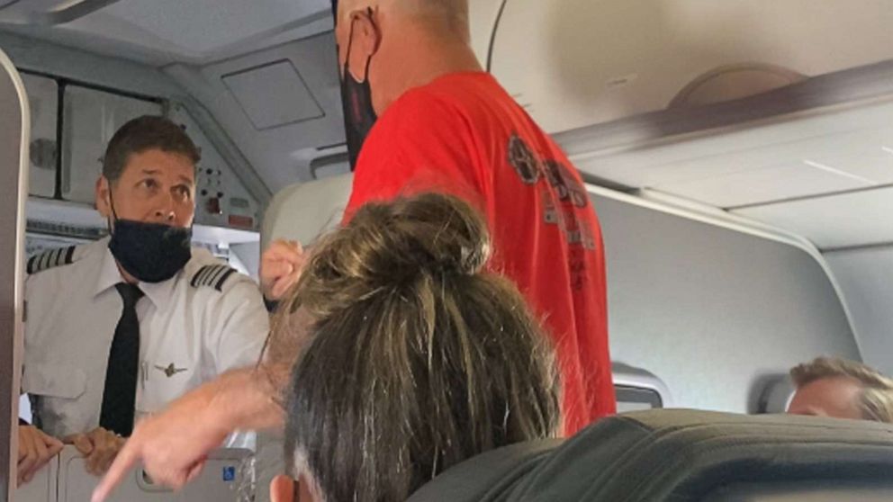 PHOTO: An unruly passenger argues with flight crew during an American Airlines flight from Los Angeles that landed in Salt Lake City on Sept. 6, 2021.