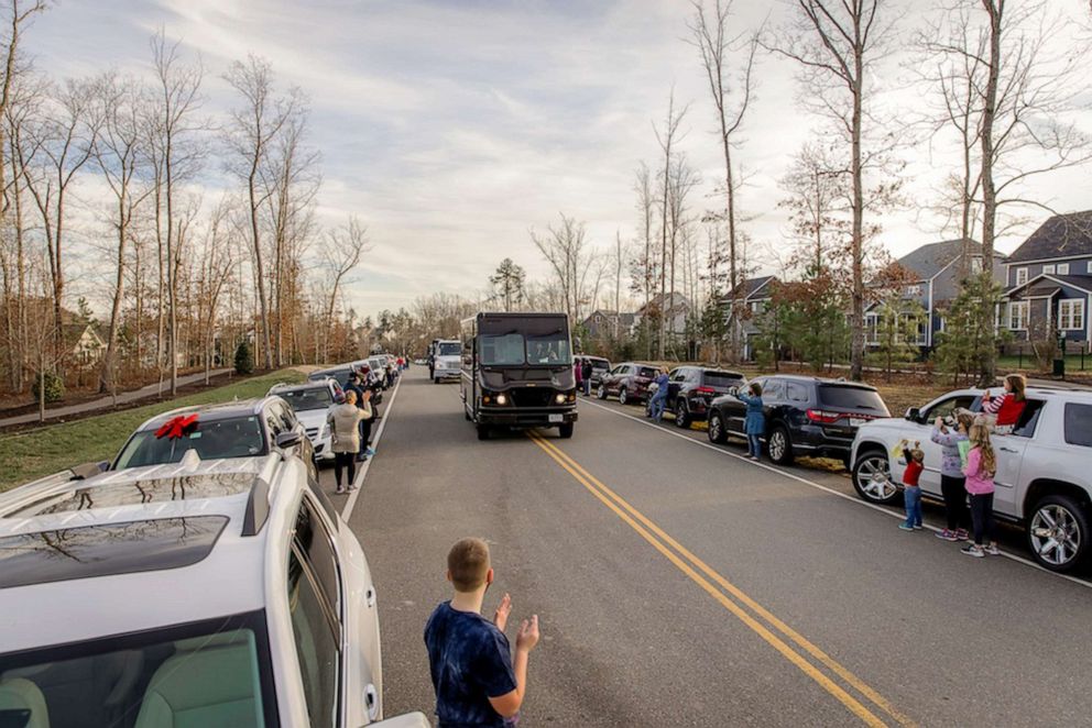 PHOTO: UPS delivery driver Anthony Gaskins drives into the Hallsey neighborhood of Chesterfield County, Virginia, surprised by residents who came out to thank him for his work.