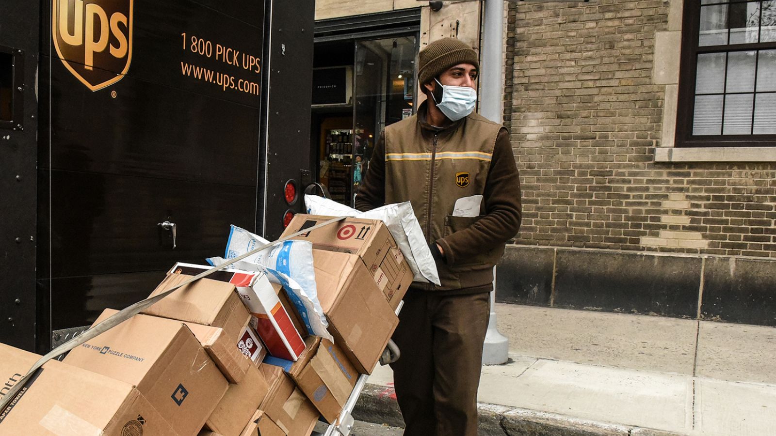 PHOTO: In this April 29, 2020, file photo, a UPS worker delivers packages in New York.