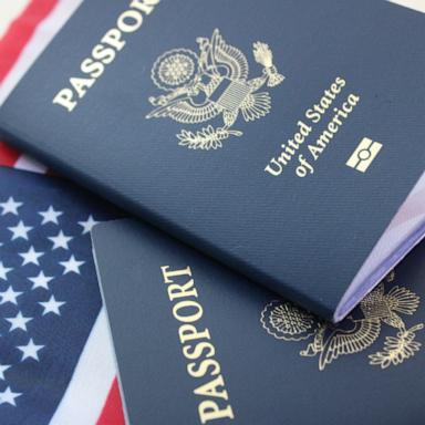 PHOTO: Close up of U.S. passports on an American flag.