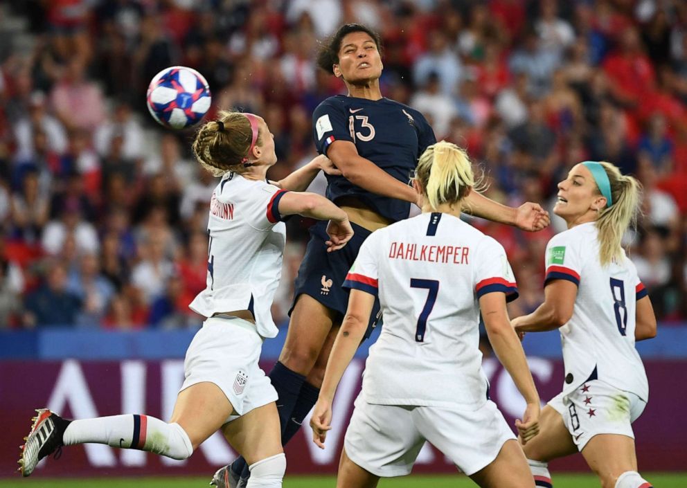 PHOTO: US players vie with France's Valerie Gauvin during the France 2019 Women's World Cup quarter-final football match between France and United States, on June 28, 2019, in Paris.