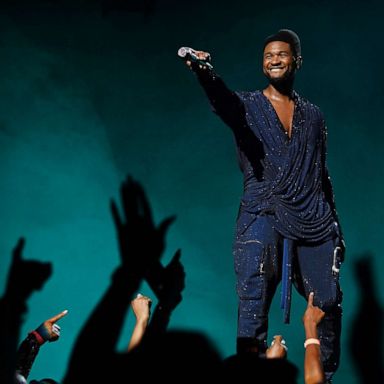 PHOTO: Usher performs at the grand opening of 