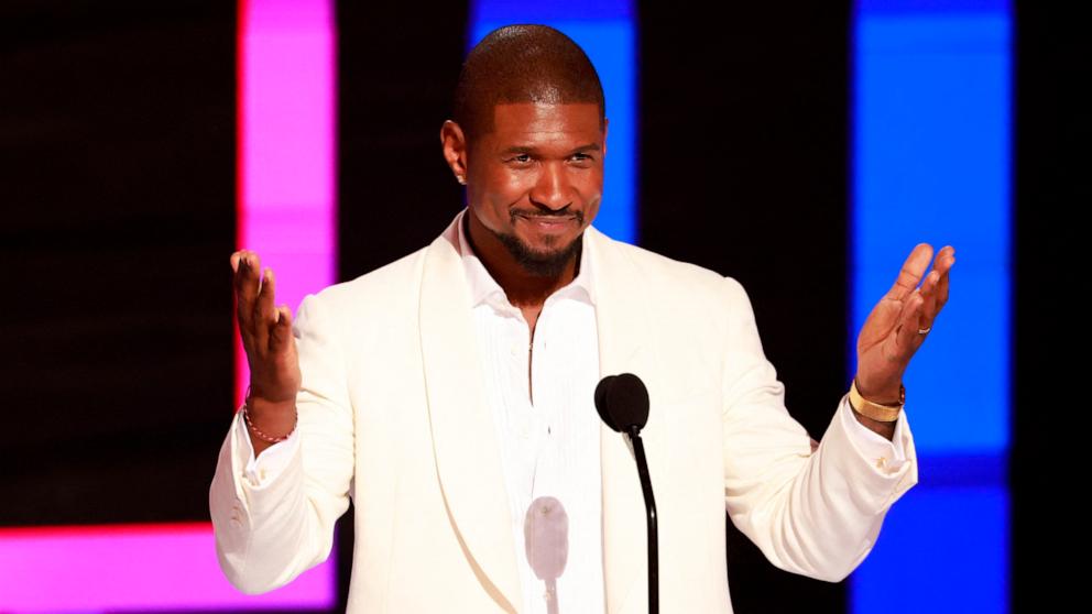 PHOTO: Usher speaks on stage after accepting the Lifetime Achievement award during the 2024 BET Awards at the Peacock theatre, June 30, 2024, in Los Angeles.