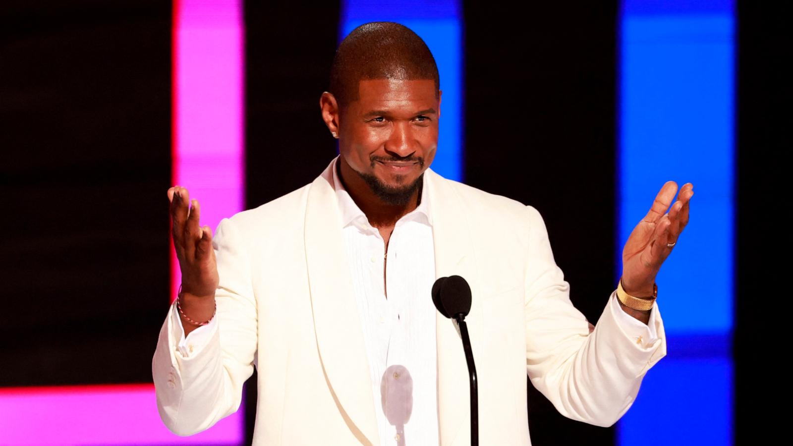 PHOTO: Usher speaks on stage after accepting the Lifetime Achievement award during the 2024 BET Awards at the Peacock theatre, June 30, 2024, in Los Angeles.