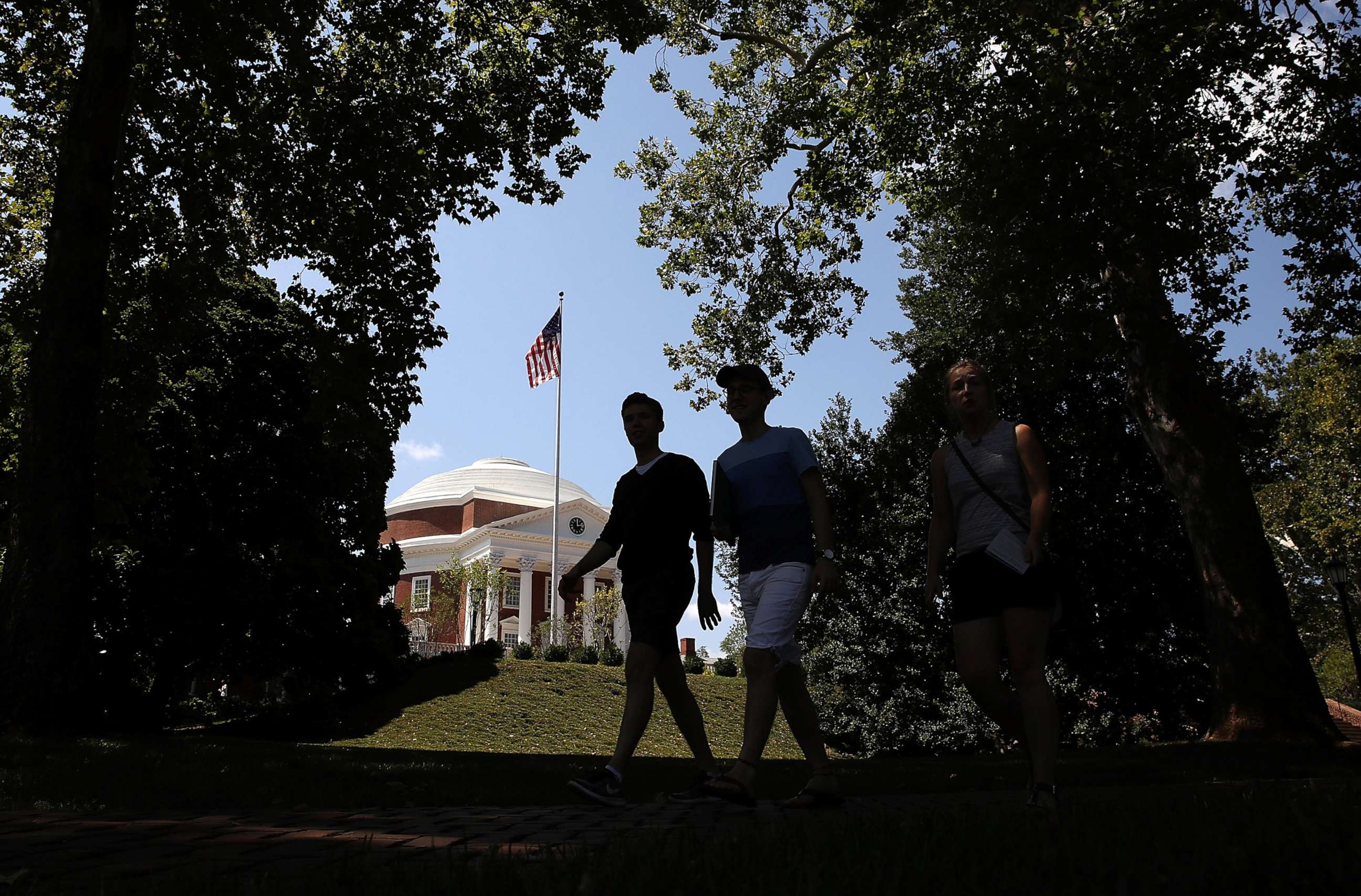 PHOTO: Students cross the campus at the University of Virginia, Aug. 19, 2017 in Charlottesville, Va.