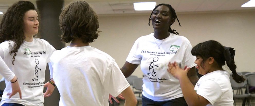 PHOTO: Zoe Touray, center, interacts with attendees at the Survivors United Playday in Uvalde, Texas, on Nov. 19, 2022.
