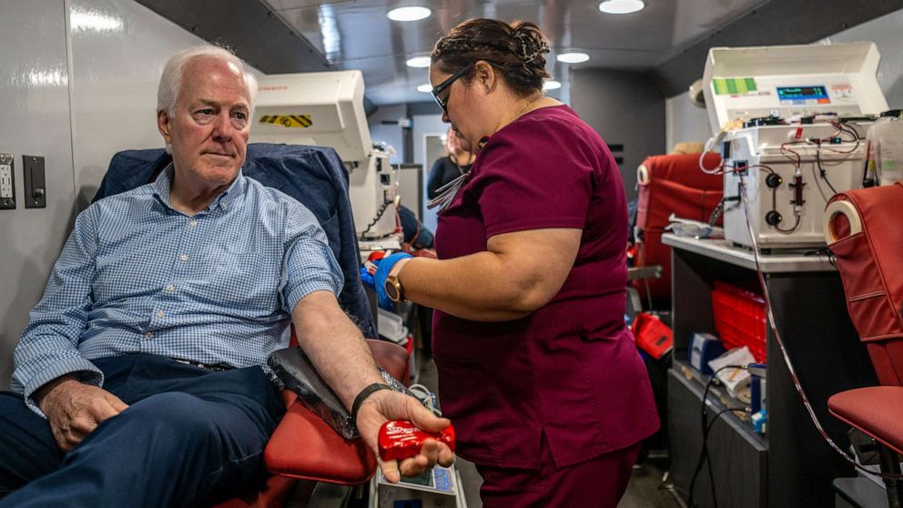 PHOTO: Texas Sen. John Cornyn prepares to donate blood at the South Texas Blood Bank's emergency blood drive on May 25, 2022 in Uvalde, Texas.