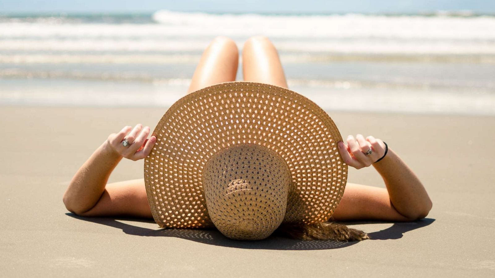 PHOTO: A woman lays on the beach in an undated stock photo.