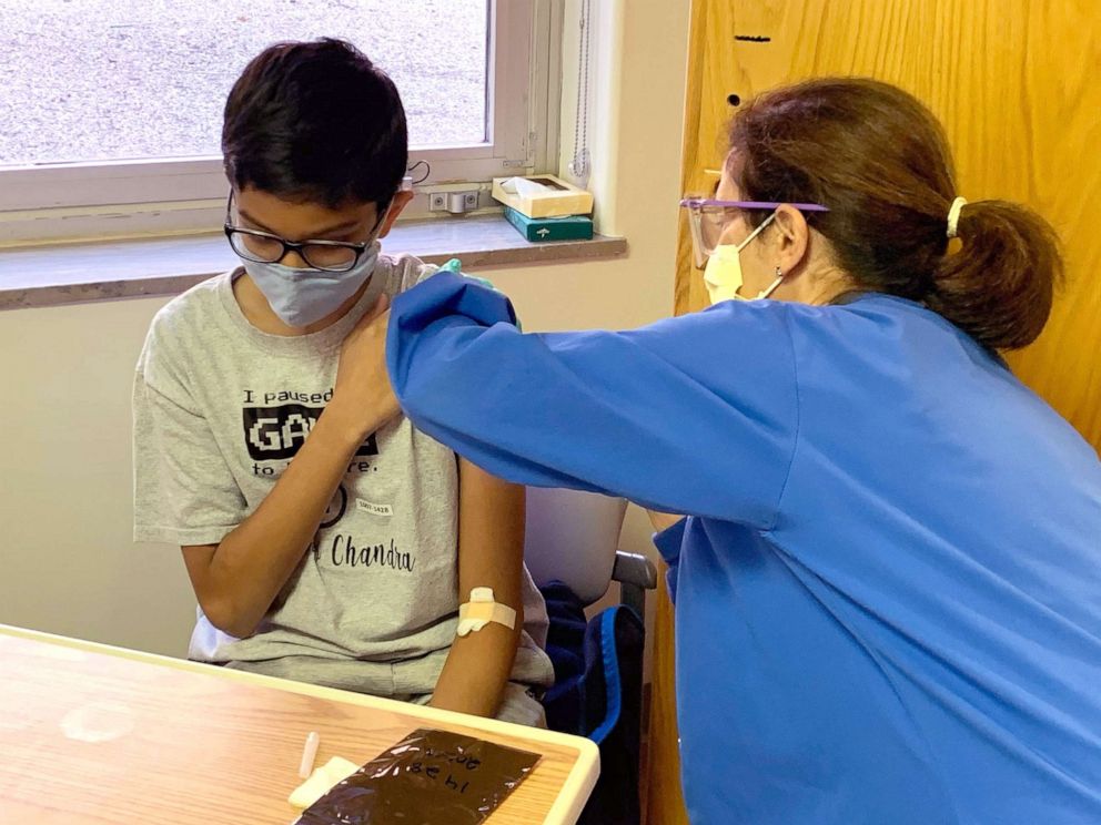 PHOTO: Abhinav, 12, receives an injection as part of Cincinnati Children's clinical trial of the Pfizer COVID-19 vaccine.