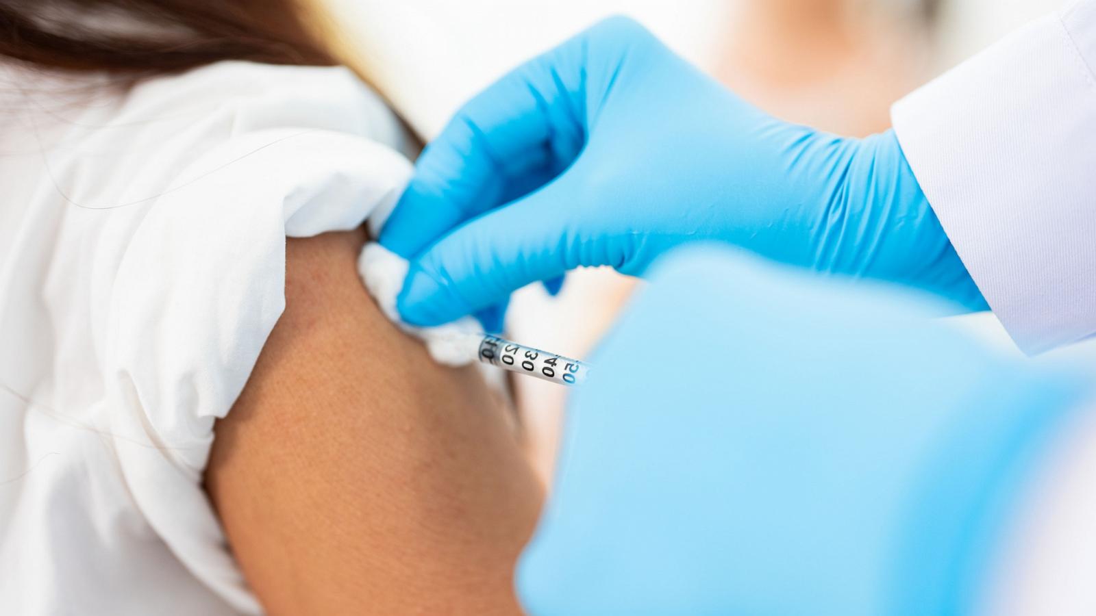 PHOTO: A woman is seen getting a vaccine in a medical unit.