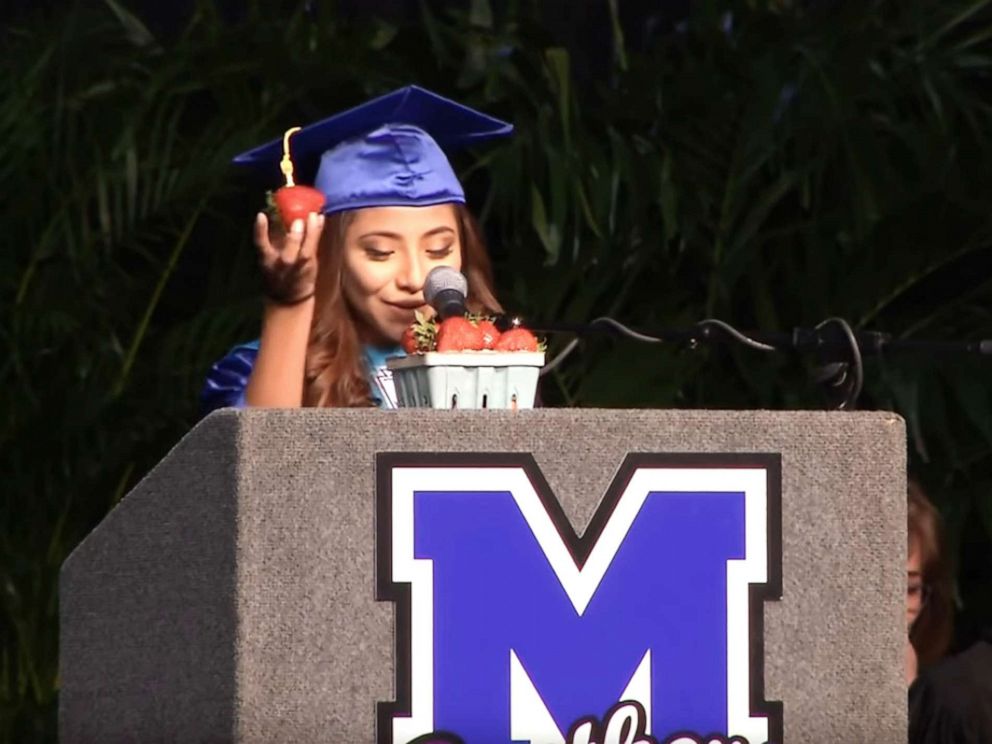 PHOTO: Brenda Alvarez-Lagunas, 18, makes a valedictorian speech at Mulberry High School in Mulberry, Fla., on May 24, 2019, where she used strawberries to thank her immigrant parents who are farmers.