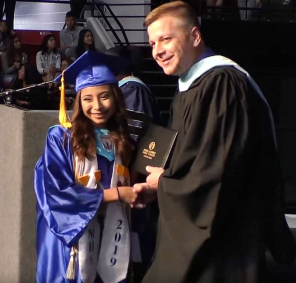 PHOTO: Brenda Alvarez-Lagunas, 18, used strawberries as a prop during her valedictorian speech to thank her immigrant parents who worked in the fields of Polk County in Florida picking fruits.