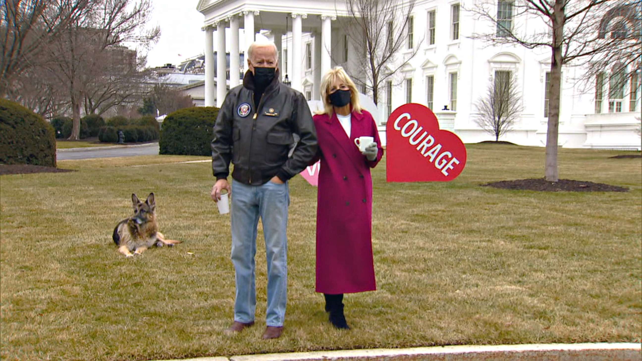 PHOTO: First lady Jill Biden and President Joe Biden look at the Valentines Jill Biden had installed overnight on the White House lawn, early Feb. 12, 2021.