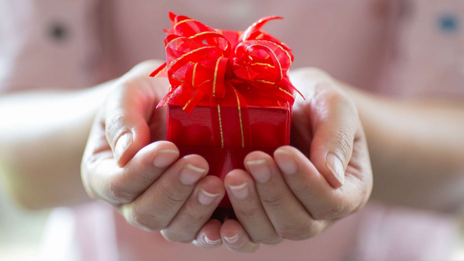 PHOTO: A woman holds a Valentine's Day gift box in an undated stock photo.