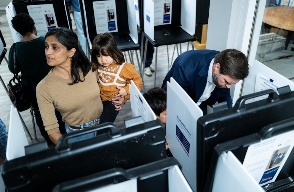 PHOTO: Republican nominee for vice president Sen. JD Vance and his wife Usha Vance fill out their ballots with their children at a polling place, Nov. 5, 2024, in Cincinnati.