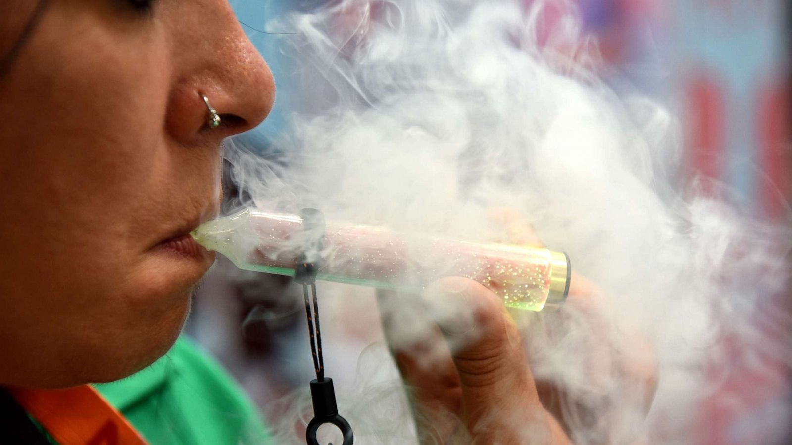 PHOTO: A person vapes on an e-cigarette during the Vaper Expo on Oct. 7, 2022, in Birmingham, England.