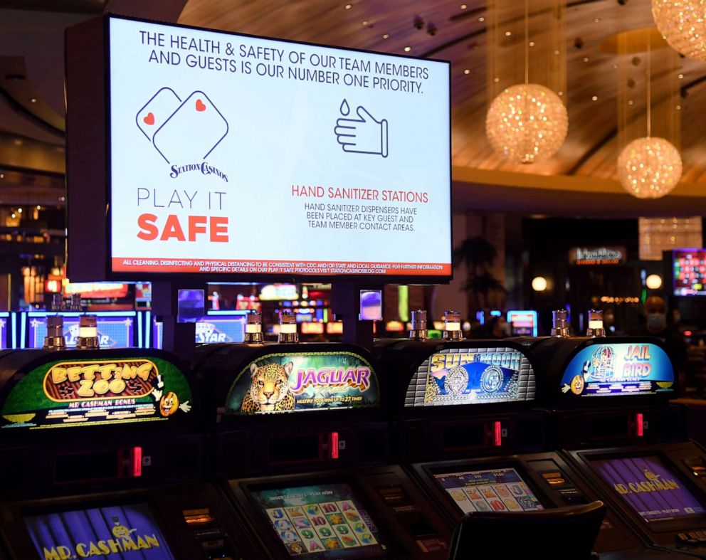 PHOTO: A monitor above a row of slot machines displays COVID-19 safety messages at the Red Rock Resort, which has been closed since March 17 because of the coronavirus pandemic as the property prepares to open on June 3, 2020 in Las Vegas.