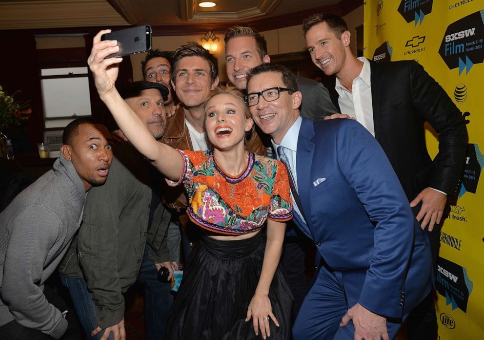 PHOTO: Kristen Bell poses for a selfie with cast members, from left, Percy Daggs, Enrico Colantoni, Chris Lowell, Ryan Hansen, Jason Dohring and director Rob Thomas at the premiere of "Veronica Mars" during SXSW 2014.