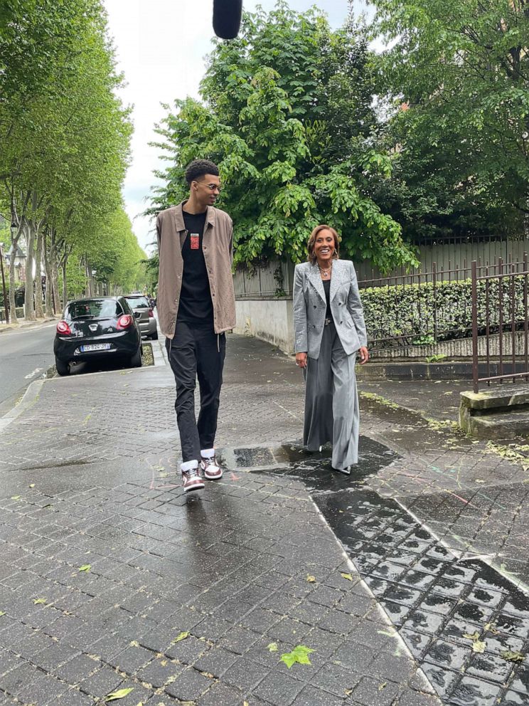 PHOTO: Basketball star Victor Wembanyama walks with Robin Roberts outside Paris, France.