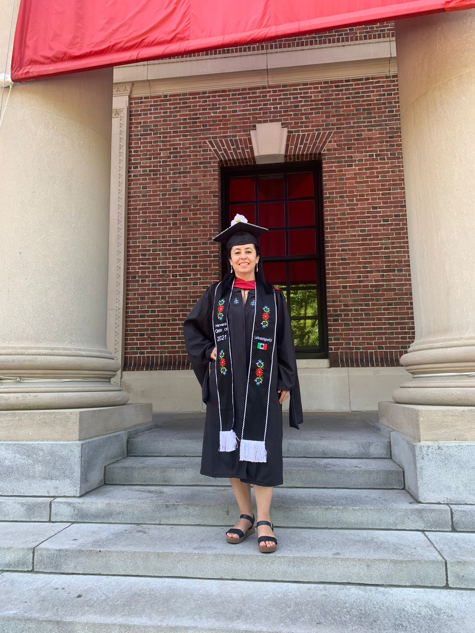 PHOTO: Nataly Morales Villa shared her cap and gown with her mom at her graduation from the Harvard Graduate School of Education on May 25, 2022.