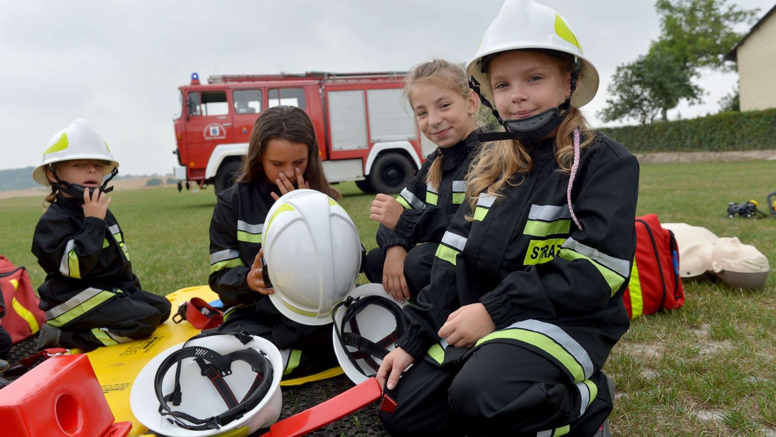 PHOTO: Girls run through a training exercise with the volunteer fire department in the town of Miejsce Odrzanskie, Poland, July 31, 2019. The small Polish town near the Czech border hasn't seen any boys born for over a decade.