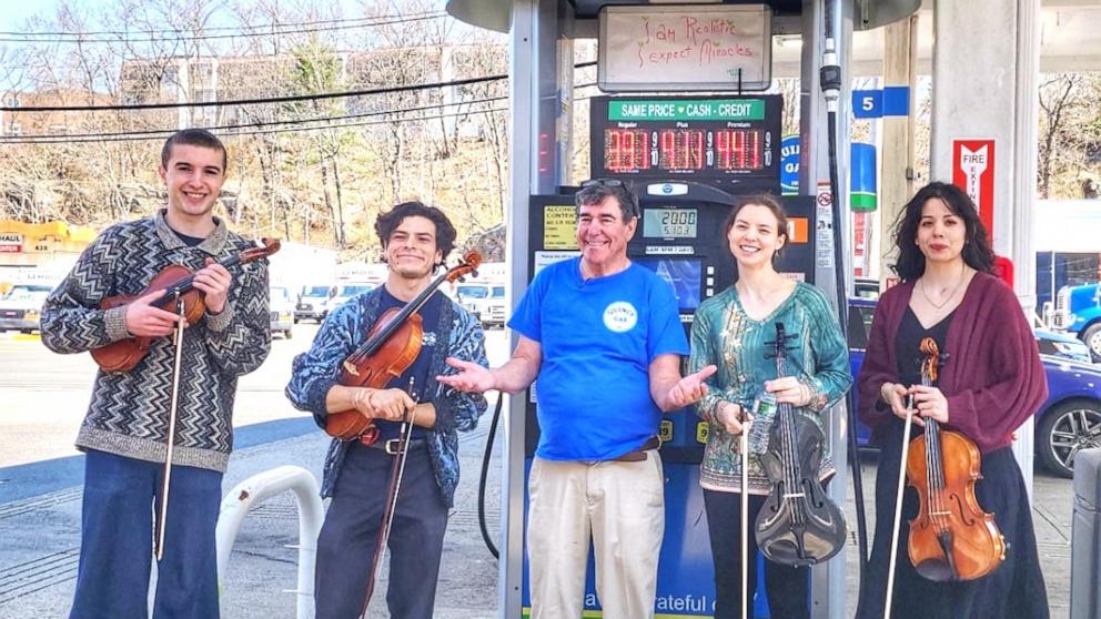 PHOTO: A rotation of violists are performing live music for customers at Quincy Gas station in Quincy, Massachusetts.
