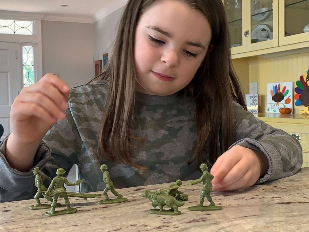 PHOTO: Vivian Lord, 7, plays with the plastic green Army women she asked Scranton, Pennsylvania-based BMC Toys to make.