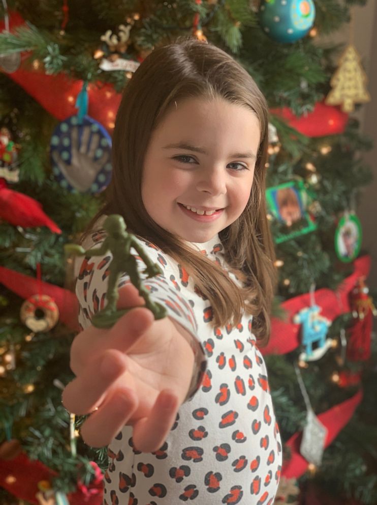 PHOTO: Vivian Lord, 7, plays with the plastic green Army women she asked Scranton, Pennsylvania-based BMC Toys to make.