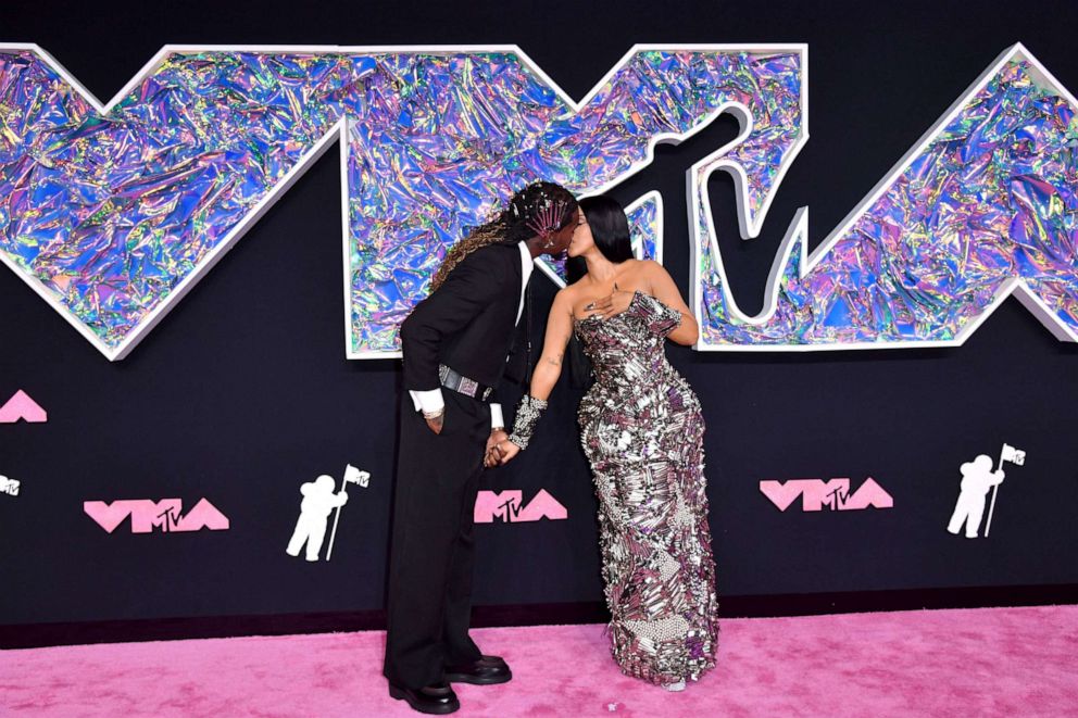 PHOTO: Rapper Cardi B and husband rapper Offset kiss as they arrive for the MTV Video Music Awards at the Prudential Center in Newark, N. J., on Sept. 12, 2023.