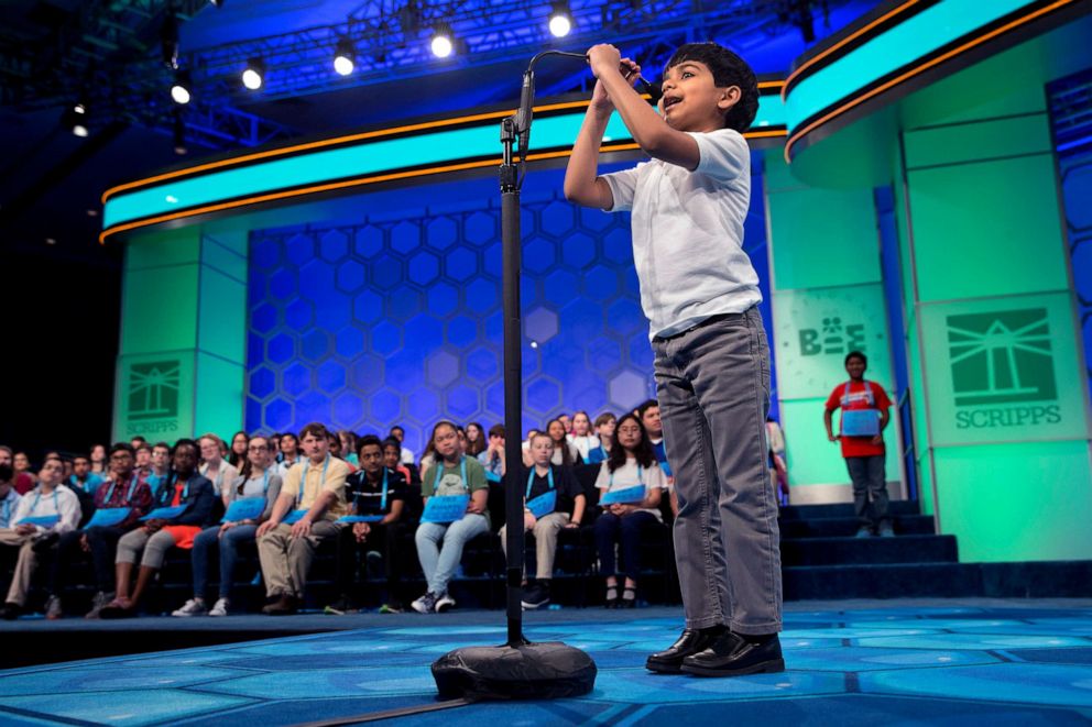 PHOTO: Six-year-old Akash Vukoti, of San Angelo, Texas, the youngest contestant in the 2016 National Spelling Bee, pulls down his microphone to compete in the preliminaries of the Bee at National Harbor, Md., May 25, 2016.