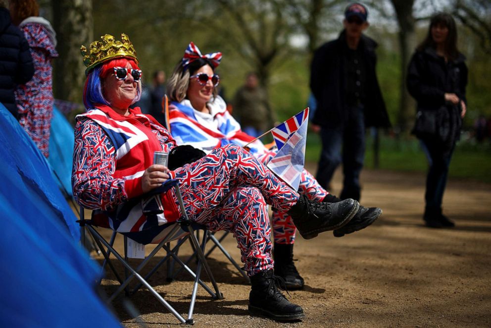 PHOTO: Well-wishers wait on The Mall outside Buckingham Palace ahead of the coronation of Britain's King Charles and Camilla, Queen Consort, in London, May 5, 2023.
