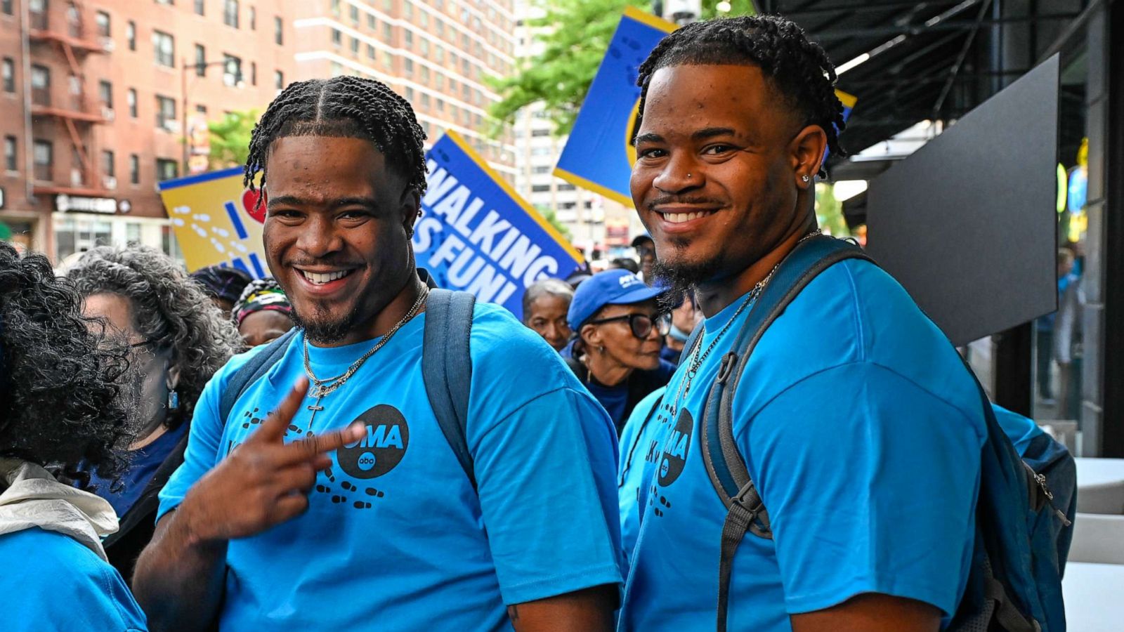 PHOTO: Twin brothers Davon and Tavon Woods walk Times Square to raise awareness for the foster care system, May 10, 2023, on "Good Morning America."