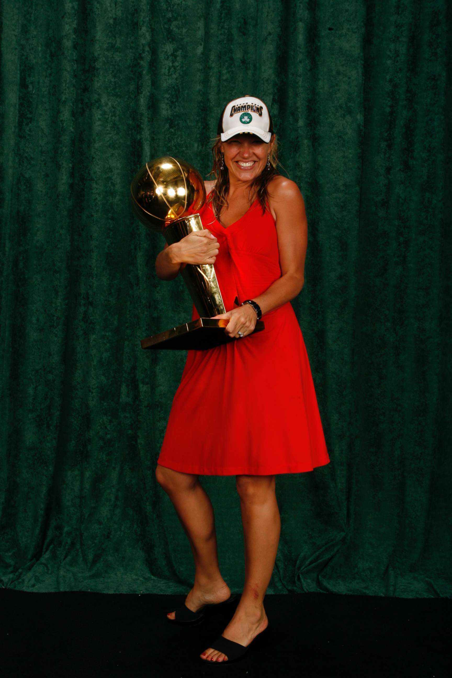 PHOTO: Heather Walker, a vice-president of public relations for the Boston Celtics, poses with the NBA Championship Trophy in 2008.