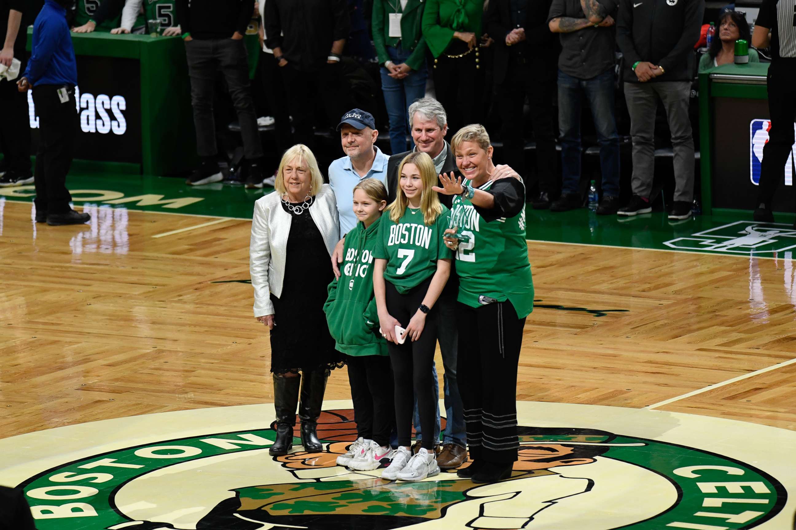 PHOTO: Heather Walker is awarded the Celtics' "Hero Among Us" award, which honors individuals who have made an overwhelming impact on the lives of others, in March 2022.
