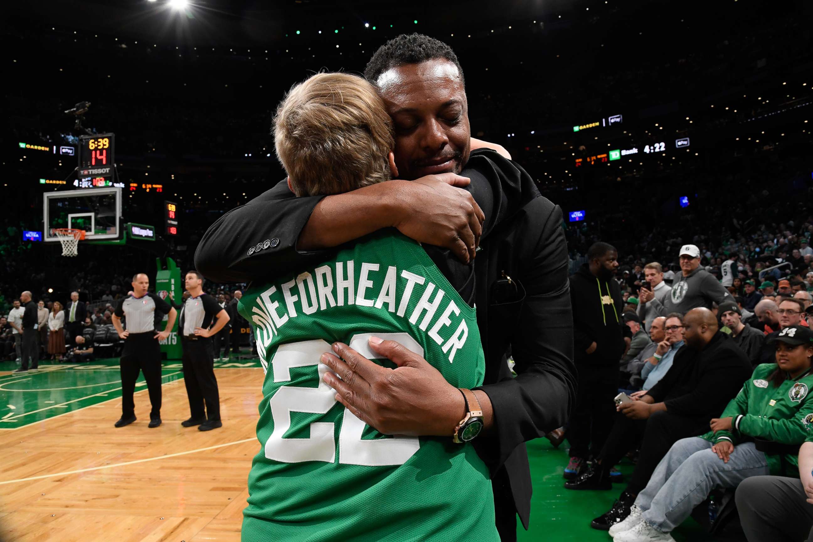 PHOTO: Heather Walker hugs Celtics legend Paul Pierce in March 2022 after she is awarded the Celtics' "Hero Among Us" award.