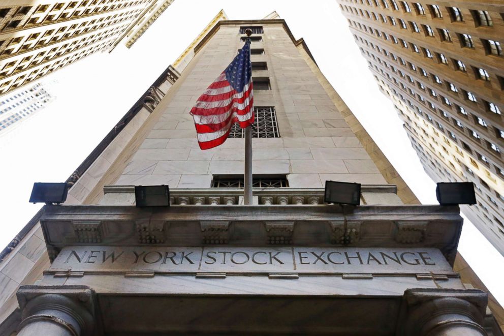 PHOTO: The American flag flies above the Wall Street entrance to the New York Stock Exchange in New York, Nov. 13, 2015.