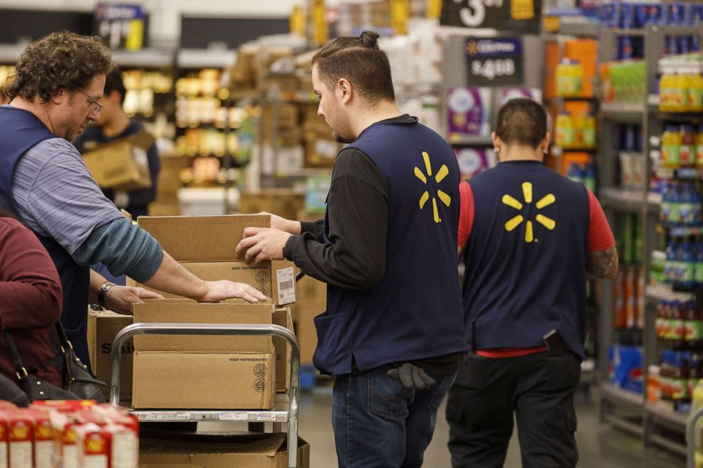 PHOTO: Employees restock merchandise at a Walmart Inc. store in Burbank, Calif., Nov. 26, 2019.