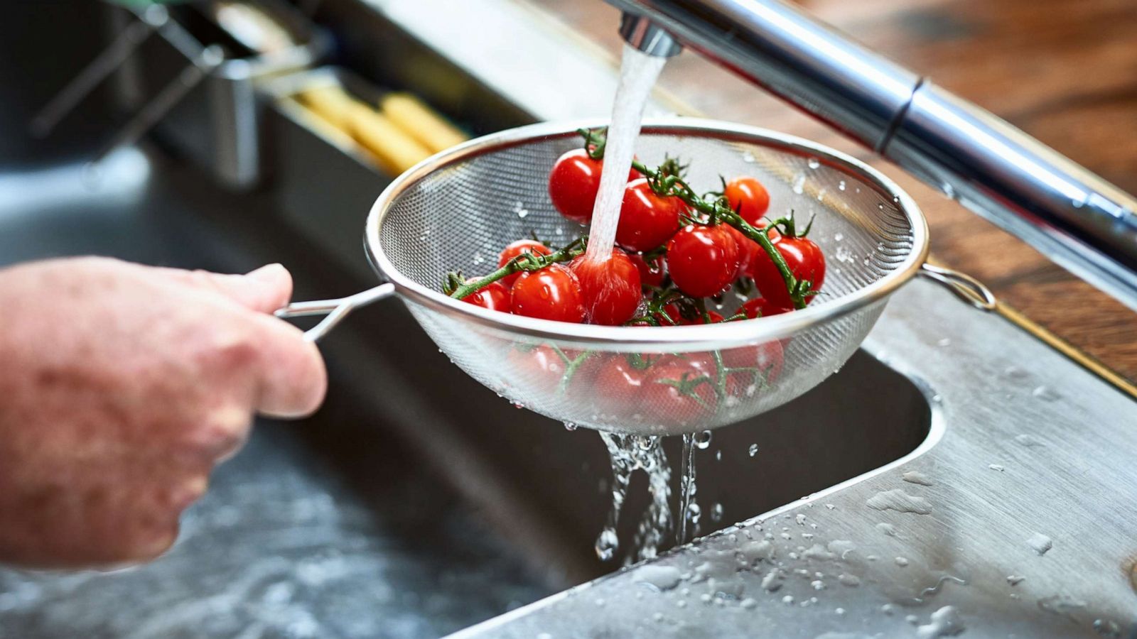 PHOTO: Tomatoes are washed in a sink in this stock photo.