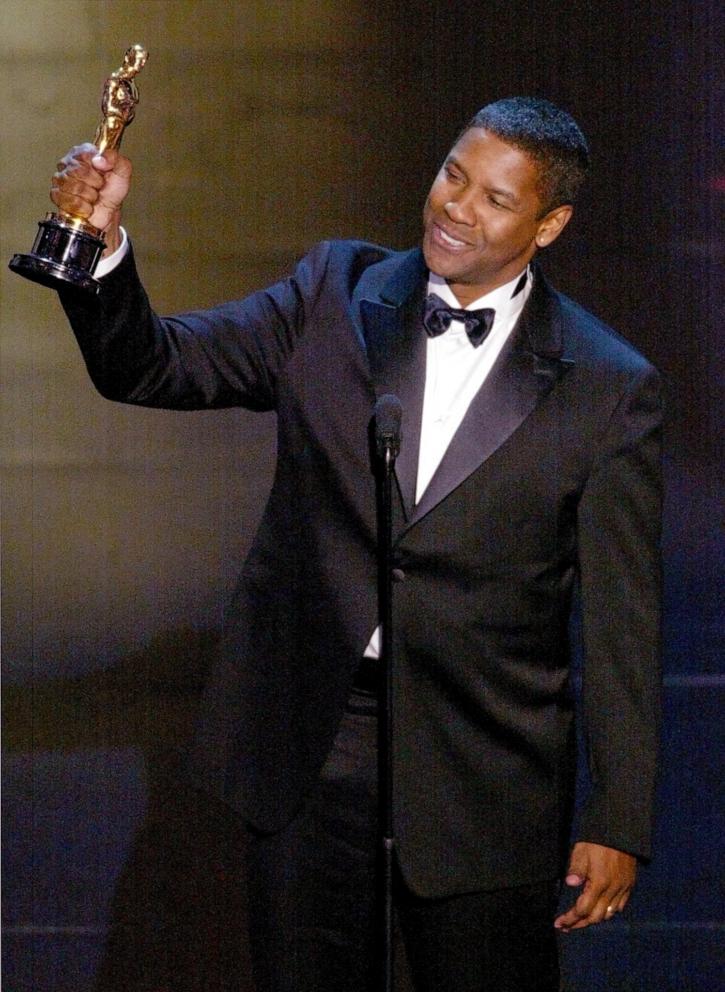 PHOTO: Denzel Washington accepts his Oscar for Best performance by an actor in a leading role, at the 74th Academy Awards at the Kodak Theater in Hollywood, Calif., on March 24, 2002.