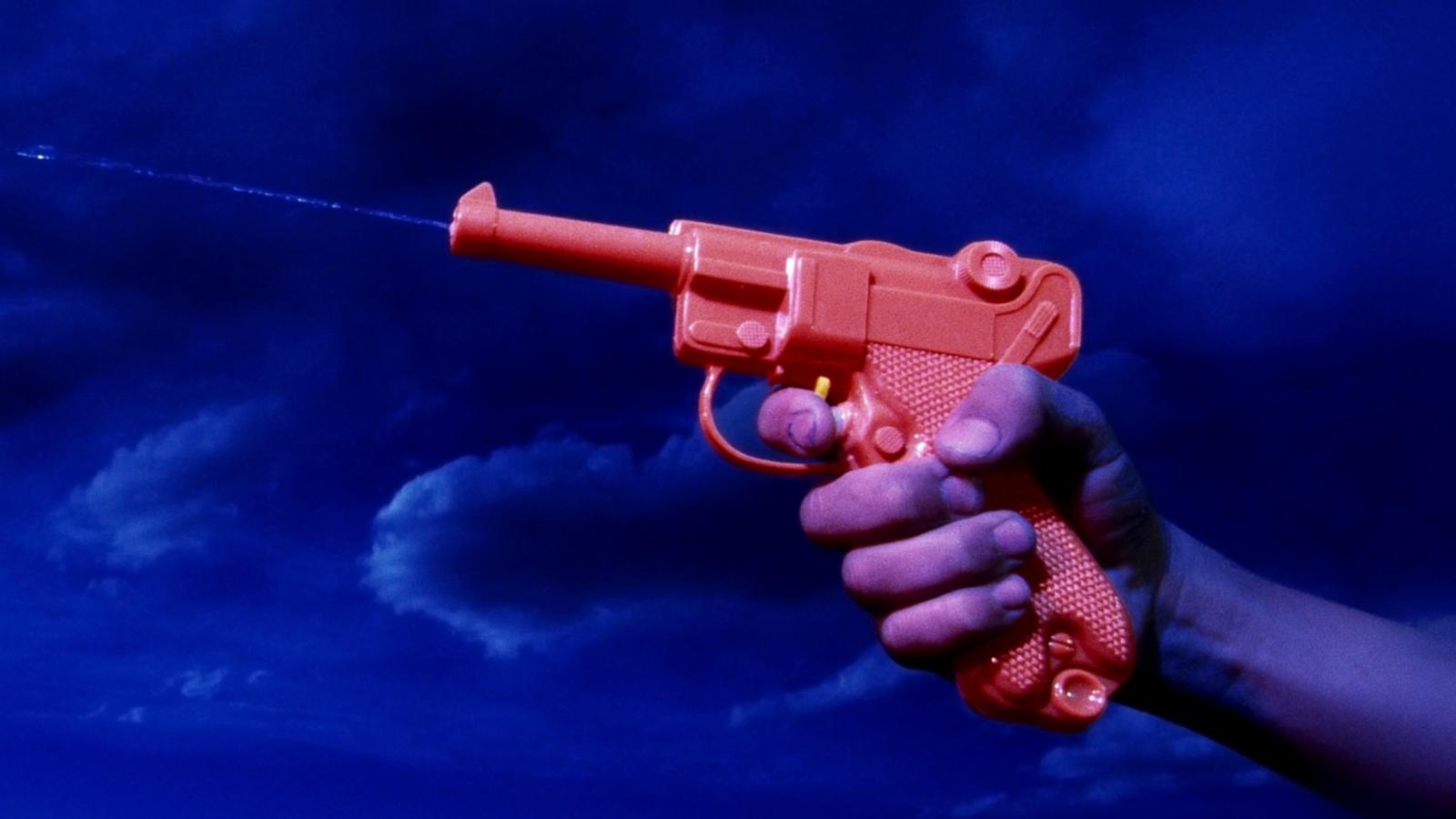PHOTO: A person shoots with a watergun.