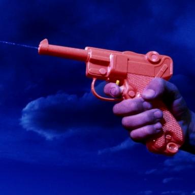 PHOTO: A person shoots with a watergun.