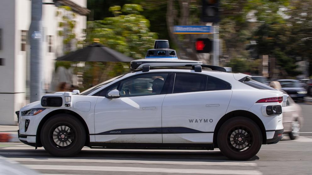 PHOTO:Passengers ride in an electric Jaguar I-Pace car outfitted with Waymo full self-driving technology in Santa Monica, Calif., Feb. 21, 2023. 