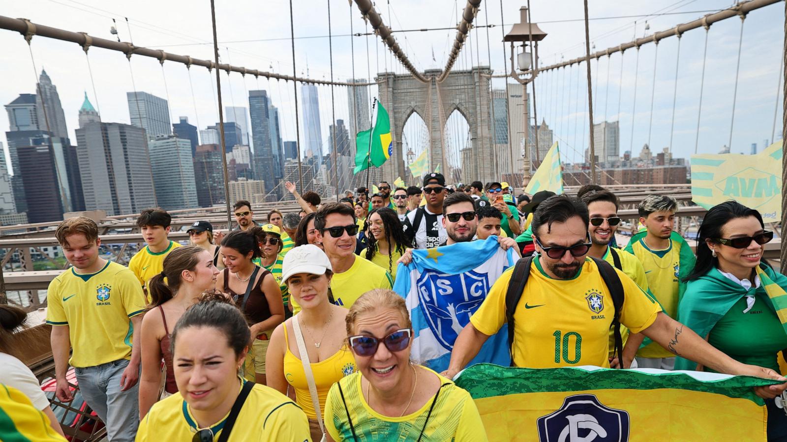 PHOTO: Brazilian soccer fans walk across Brooklyn Bridge in New York City, June 14, 2026.