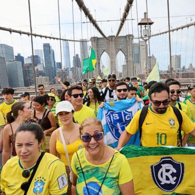 PHOTO: Brazilian soccer fans walk across Brooklyn Bridge in New York City, June 14, 2026.